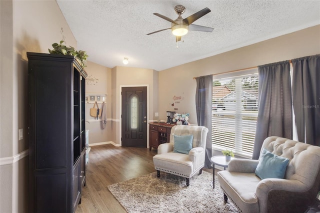 2816 Manor Hill Dr, Brandon, FL 33511 - sitting room with a textured ceiling, a ceiling fan, and wood finished floors