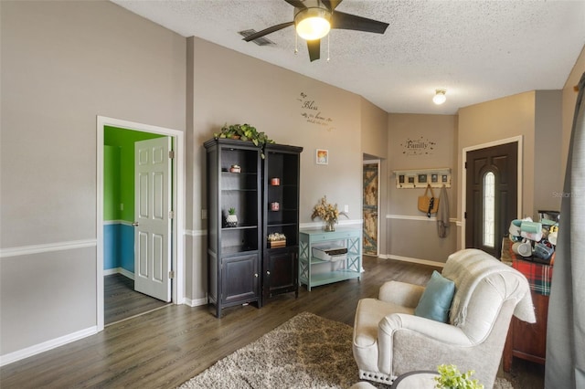 2816 Manor Hill Dr, Brandon, FL 33511 - living area featuring dark wood-style flooring, a ceiling fan, and a textured ceiling