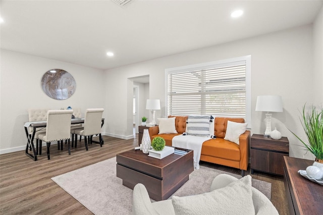 living room with recessed lighting, wood finished floors, and baseboards