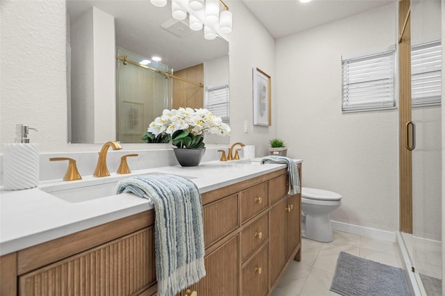 bathroom featuring a shower stall, toilet, and double vanity