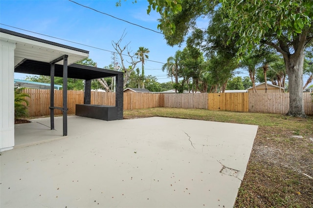 fenced backyard featuring a patio area