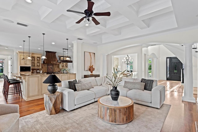 17129 Breeders Cup Dr, Odessa, FL 33556 - living room featuring decorative columns, healthy amount of natural light, recessed lighting, light wood-style floors, and beam ceiling