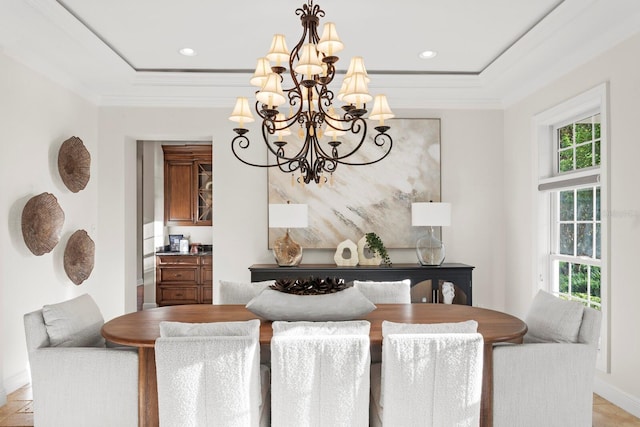 17129 Breeders Cup Dr, Odessa, FL 33556 - dining area with a chandelier, baseboards, ornamental molding, recessed lighting, and a tray ceiling