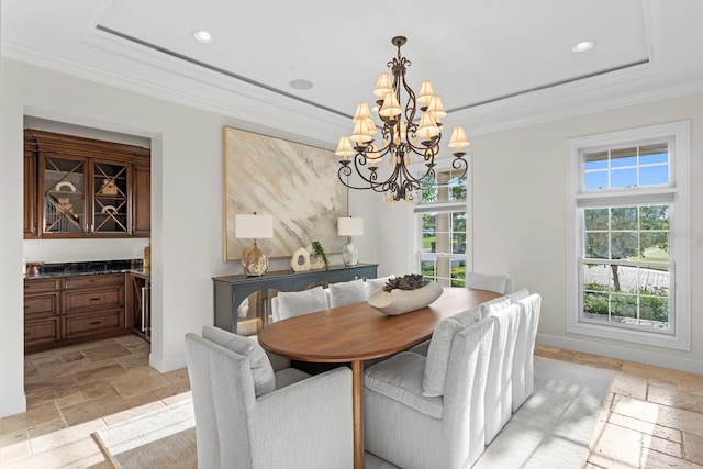 17129 Breeders Cup Dr, Odessa, FL 33556 - dining area featuring stone tile flooring, a chandelier, ornamental molding, a tray ceiling, and recessed lighting