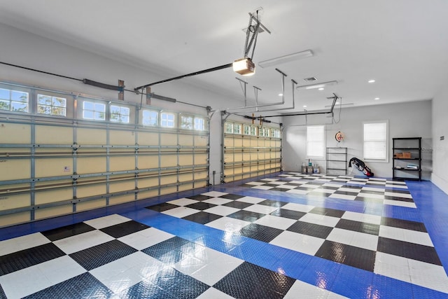 17129 Breeders Cup Dr, Odessa, FL 33556 - garage with a garage door opener and recessed lighting