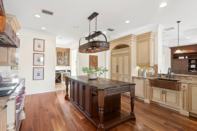 17129 Breeders Cup Dr, Odessa, FL 33556 - kitchen with cream cabinets, double oven range, tasteful backsplash, dark stone counters, and recessed lighting