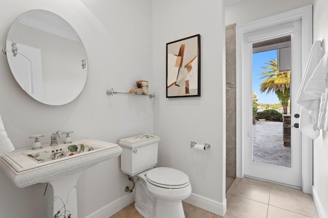 17129 Breeders Cup Dr, Odessa, FL 33556 - bathroom featuring toilet, baseboards, and tile patterned floors