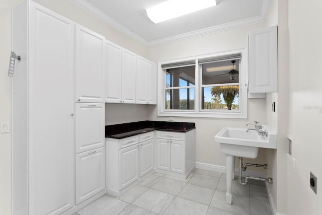 17129 Breeders Cup Dr, Odessa, FL 33556 - washroom with baseboards, cabinet space, light tile patterned floors, ornamental molding, and electric dryer hookup