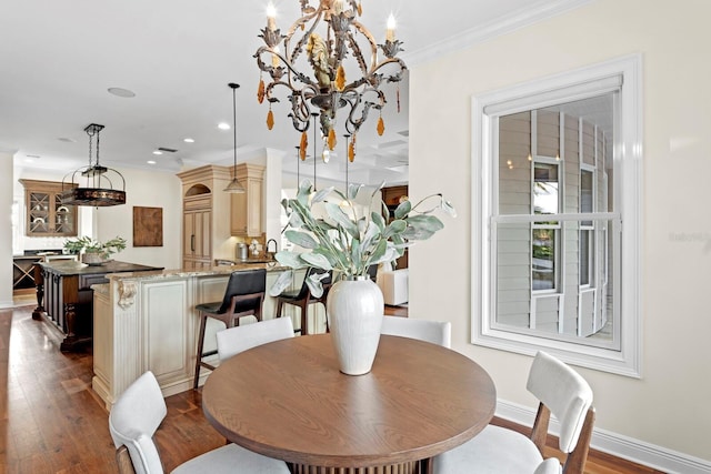 17129 Breeders Cup Dr, Odessa, FL 33556 - dining space with dark wood-style floors, ornamental molding, baseboards, a chandelier, and recessed lighting