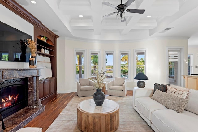 17129 Breeders Cup Dr, Odessa, FL 33556 - living area with ornamental molding, healthy amount of natural light, wood finished floors, ceiling fan, and beam ceiling