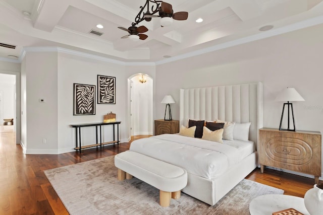 17129 Breeders Cup Dr, Odessa, FL 33556 - bedroom featuring coffered ceiling, crown molding, arched walkways, wood finished floors, and beam ceiling