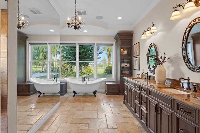 17129 Breeders Cup Dr, Odessa, FL 33556 - full bathroom featuring stone tile flooring, a chandelier, double vanity, recessed lighting, and ornamental molding
