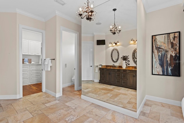 17129 Breeders Cup Dr, Odessa, FL 33556 - bathroom featuring stone tile flooring, toilet, a chandelier, vanity, and ornamental molding