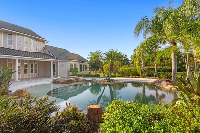 17129 Breeders Cup Dr, Odessa, FL 33556 - view of swimming pool featuring a patio area and a pool with connected hot tub