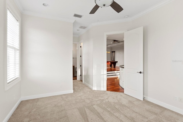 17129 Breeders Cup Dr, Odessa, FL 33556 - unfurnished bedroom with carpet, multiple windows, ornamental molding, baseboards, and ceiling fan