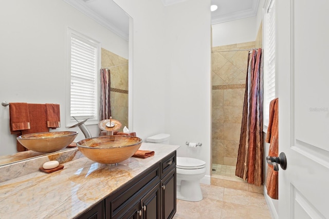 17129 Breeders Cup Dr, Odessa, FL 33556 - bathroom with toilet, ornamental molding, vanity, tiled shower, and tile patterned flooring