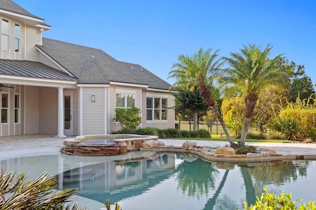 17129 Breeders Cup Dr, Odessa, FL 33556 - view of swimming pool with a patio and a pool with connected hot tub