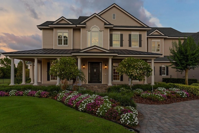 17129 Breeders Cup Dr, Odessa, FL 33556 - craftsman house featuring a standing seam roof, a porch, and metal roof
