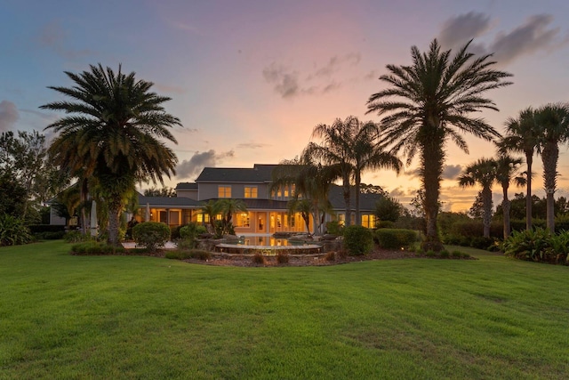 17129 Breeders Cup Dr, Odessa, FL 33556 - back of property at dusk with a yard