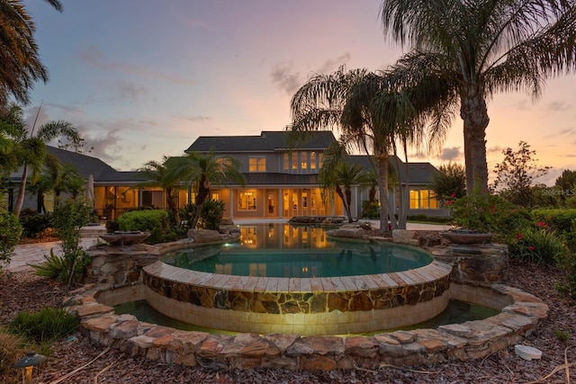 17129 Breeders Cup Dr, Odessa, FL 33556 - pool at dusk featuring an outdoor pool