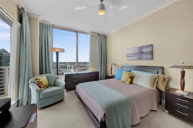 449 S 12th St Unit 2205, Tampa, FL 33602 - bedroom with light carpet, ornamental molding, floor to ceiling windows, and a ceiling fan
