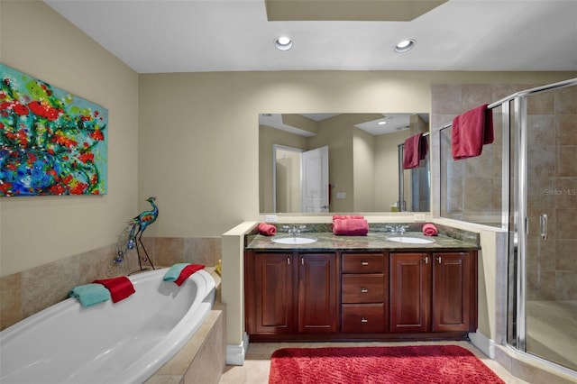 449 S 12th St Unit 2205, Tampa, FL 33602 - bathroom featuring a shower stall, a garden tub, double vanity, and recessed lighting