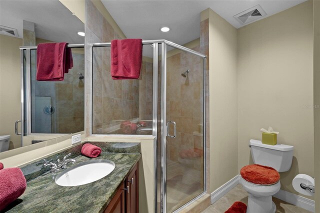 449 S 12th St Unit 2205, Tampa, FL 33602 - bathroom with toilet, a shower stall, vanity, tile patterned floors, and recessed lighting