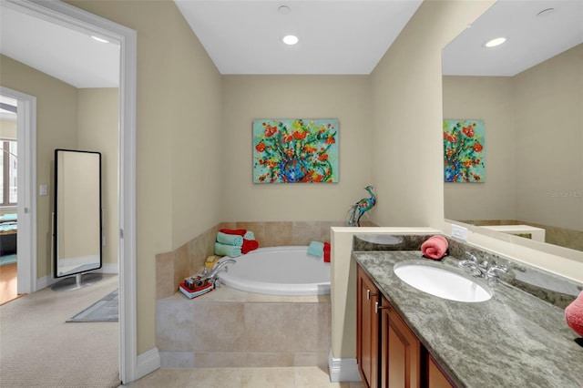 449 S 12th St Unit 2205, Tampa, FL 33602 - bathroom featuring vanity, a garden tub, recessed lighting, and baseboards