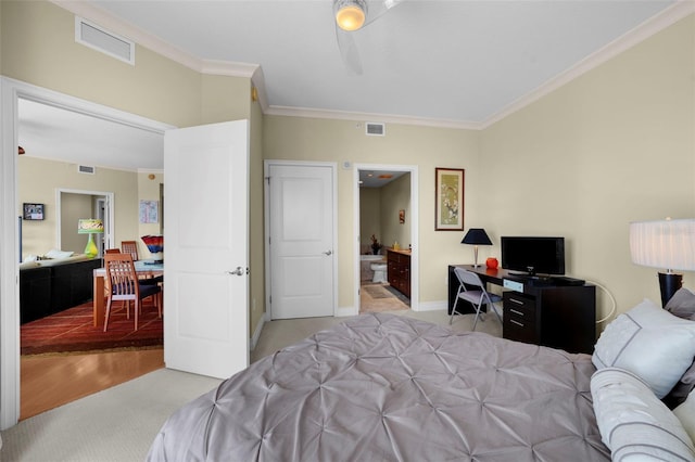 449 S 12th St Unit 2205, Tampa, FL 33602 - bedroom featuring light carpet, crown molding, a desk, connected bathroom, and baseboards