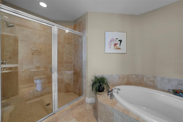 449 S 12th St Unit 2205, Tampa, FL 33602 - bathroom featuring a garden tub, a stall shower, and tile patterned flooring