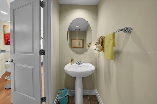 449 S 12th St Unit 2205, Tampa, FL 33602 - bathroom featuring baseboards and a sink