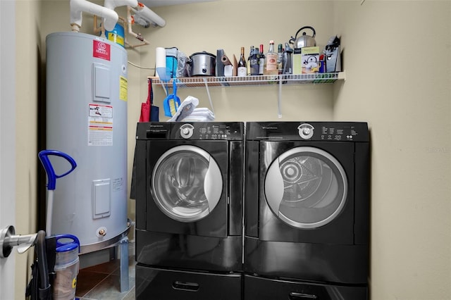 449 S 12th St Unit 2205, Tampa, FL 33602 - washroom with electric water heater, independent washer and dryer, and tile patterned flooring
