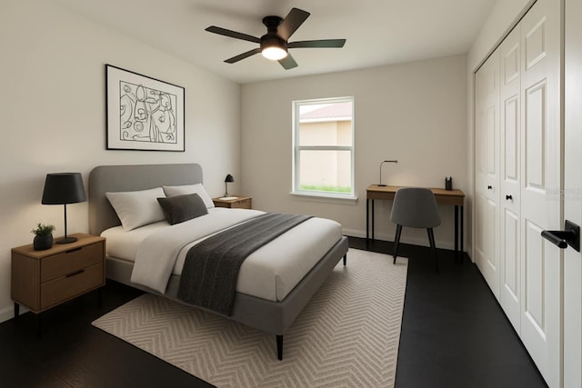 bedroom with a closet, ceiling fan, baseboards, and wood finished floors