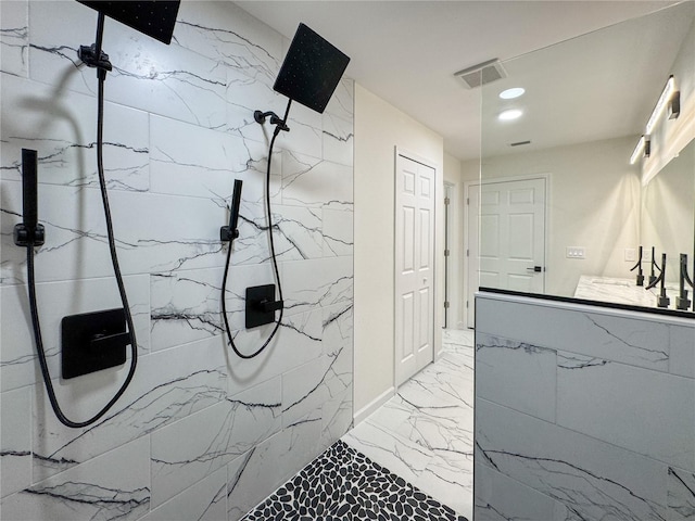 full bathroom featuring marble tiled floors, a marble finish shower, vanity, and recessed lighting