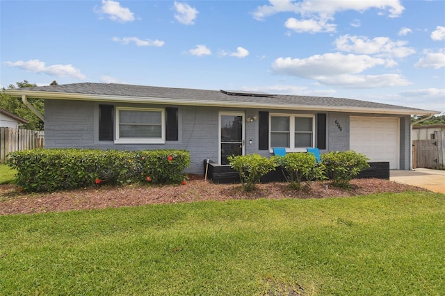 6246 Bandura Ave, New Port Richey, FL 34653 - single story home featuring an attached garage, solar panels, and driveway