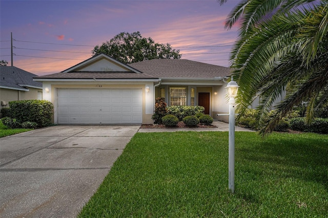 1744 Brookstone Way, Plant City, FL 33566 - ranch-style home with a garage, driveway, stucco siding, a front lawn, and a shingled roof