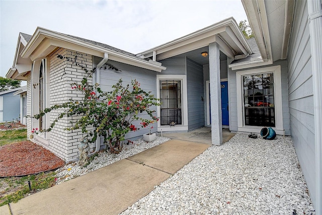 8913 Welsh Way, Hudson, FL 34667 - view of exterior entry featuring brick siding
