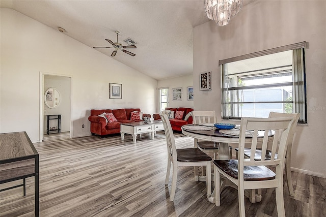 8913 Welsh Way, Hudson, FL 34667 - dining space featuring wood finished floors, a ceiling fan, and high vaulted ceiling