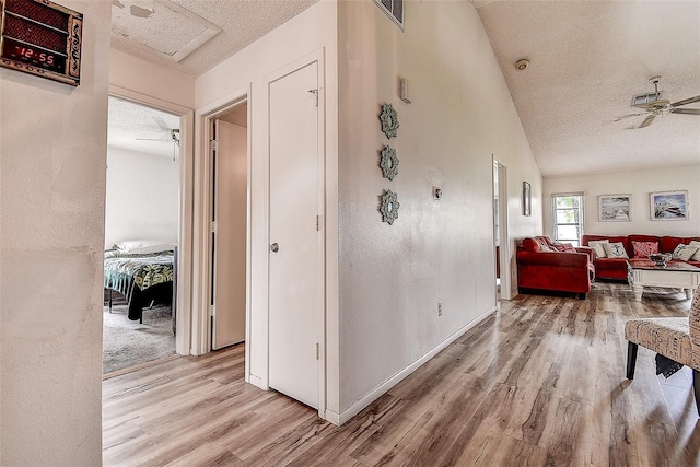 8913 Welsh Way, Hudson, FL 34667 - hallway featuring wood finished floors and a textured ceiling