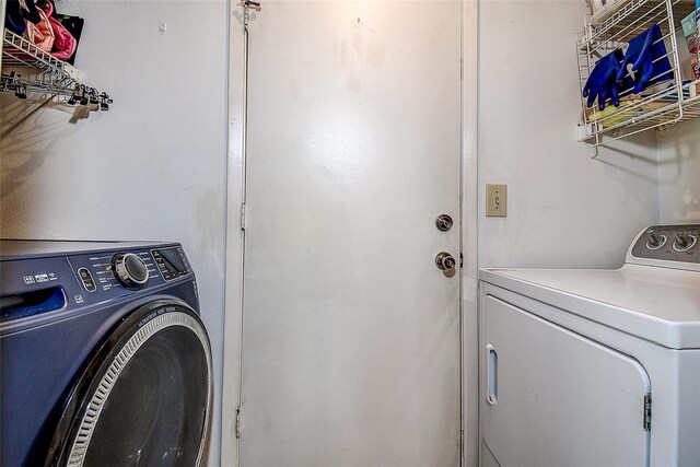8913 Welsh Way, Hudson, FL 34667 - washroom featuring washing machine and clothes dryer