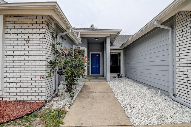 8913 Welsh Way, Hudson, FL 34667 - view of exterior entry featuring brick siding