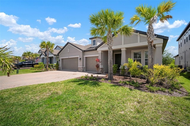 923 Whimbrel Run, Bradenton, FL 34212 - view of front of property with stucco siding, an attached garage, decorative driveway, and a front lawn