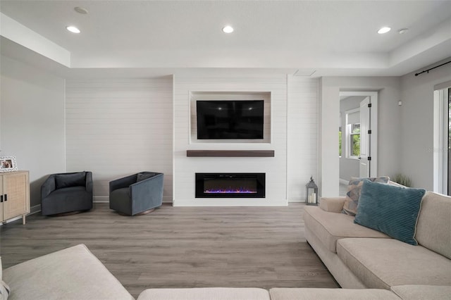 923 Whimbrel Run, Bradenton, FL 34212 - living area with wood finished floors, recessed lighting, and a glass covered fireplace