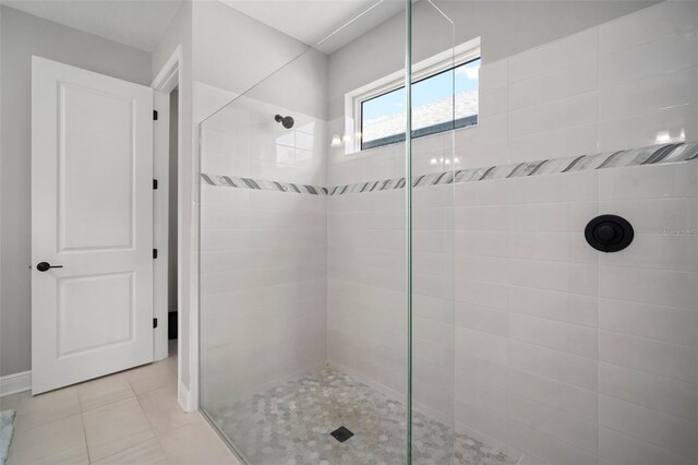 923 Whimbrel Run, Bradenton, FL 34212 - full bath featuring walk in shower, tile patterned floors, and baseboards