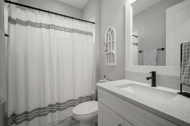 923 Whimbrel Run, Bradenton, FL 34212 - bathroom featuring toilet, vanity, and shower / bathtub combination with curtain