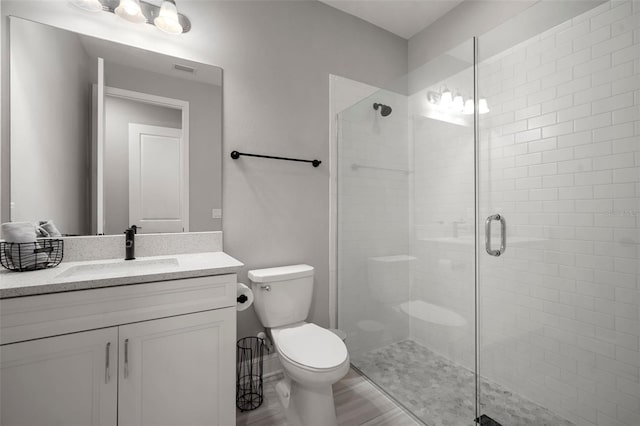 923 Whimbrel Run, Bradenton, FL 34212 - bathroom featuring a shower stall, toilet, and vanity