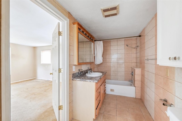 1810 Maryland Ave NE, Saint Petersburg, FL 33703 - bathroom with tub / shower combination, vanity, and tile patterned floors