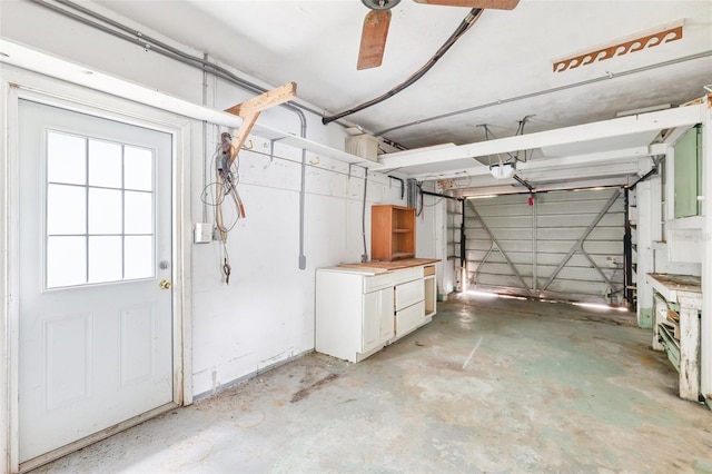 1810 Maryland Ave NE, Saint Petersburg, FL 33703 - garage featuring a garage door opener and ceiling fan