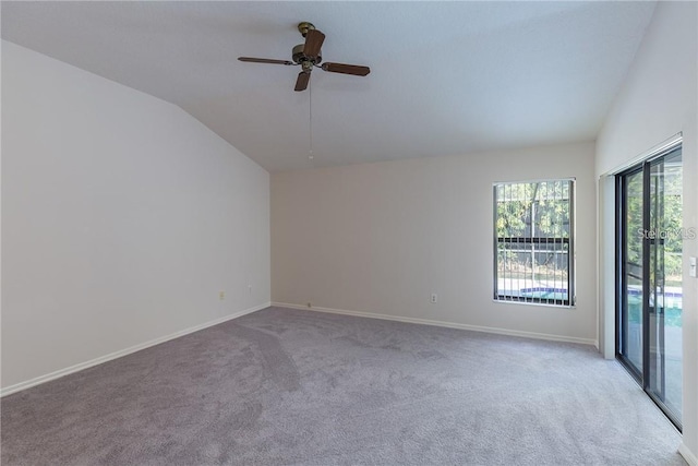 9220 Dayflower Dr, Tampa, FL 33647 - empty room featuring lofted ceiling, carpet, a ceiling fan, and baseboards