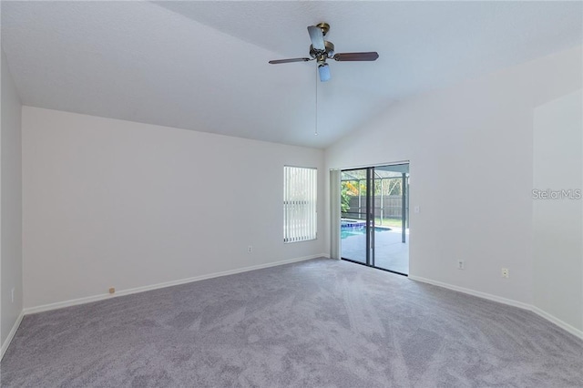 9220 Dayflower Dr, Tampa, FL 33647 - spare room featuring ceiling fan, baseboards, carpet flooring, and vaulted ceiling